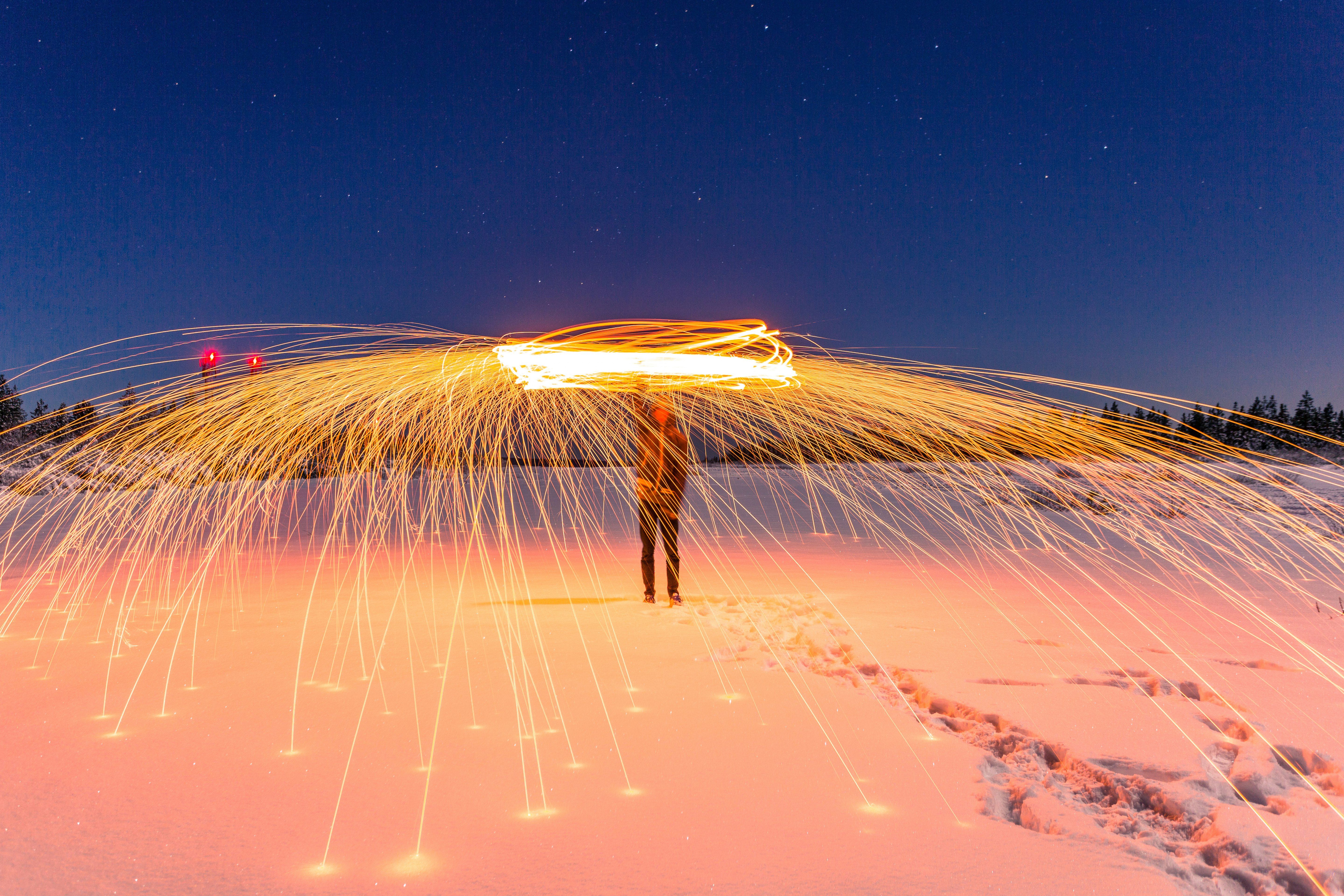 time lapse photography of man performing fire dance